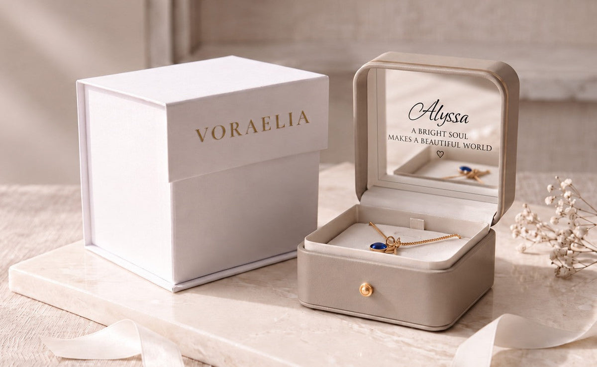 Voraelia gift presentation with branded white box, personalized champagne keepsake jewelry box and necklace