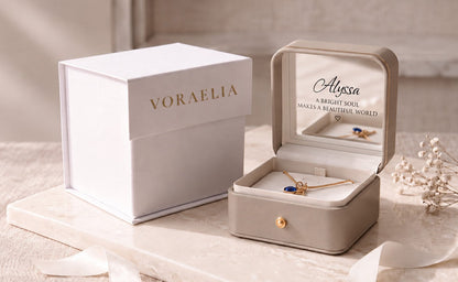 Voraelia gift presentation with branded white box, personalized champagne keepsake jewelry box and necklace